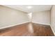 Bright living room featuring hardwood floors and neutral walls at 256 Castlekeeper Pl, Valrico, FL 33594