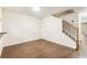 Spacious living room with hardwood floors, with stairs leading to the second floor at 256 Castlekeeper Pl, Valrico, FL 33594