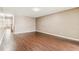 Expansive living room featuring hardwood floors and neutral walls at 256 Castlekeeper Pl, Valrico, FL 33594