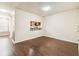 Spacious living room featuring hardwood floors and a kitchen pass-through at 256 Castlekeeper Pl, Valrico, FL 33594