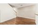 Bright living room featuring hardwood floors and stairs with white risers at 256 Castlekeeper Pl, Valrico, FL 33594