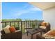 Relaxing balcony with seating and stunning ocean views perfect for enjoying coastal living at 2699 Seville Blvd # 705, Clearwater, FL 33764