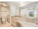 A spacious ensuite bathroom is complete with a toilet, vanity, and ample storage at 2699 Seville Blvd # 705, Clearwater, FL 33764