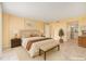 Bright bedroom featuring stylish decor, marble floors, and a comfortable seating area at 2699 Seville Blvd # 705, Clearwater, FL 33764