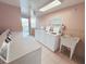 Community laundry room features multiple machines and a utility sink at 2699 Seville Blvd # 705, Clearwater, FL 33764