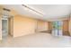 Open living space featuring tile flooring, with bathroom access and expansive views at 2699 Seville Blvd # 705, Clearwater, FL 33764