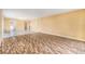 An open-concept living room boasts ceramic tile floors and ample space for entertaining at 2699 Seville Blvd # 705, Clearwater, FL 33764
