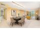 Open-concept living and dining room with plenty of natural light and neutral color palette at 2699 Seville Blvd # 705, Clearwater, FL 33764