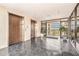 Lobby featuring elevators, tile floor, and outdoor view at 2699 Seville Blvd # 705, Clearwater, FL 33764