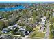 Scenic aerial view of a residential neighborhood with lush greenery and a glimpse of the serene lake at 318 Banana St, Tarpon Springs, FL 34689