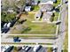 Aerial view of homes with spacious lawns, conveniently located near parking and recreational areas at 318 Banana St, Tarpon Springs, FL 34689