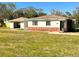 Charming single-story home with a separate garage and well-maintained lawn at 318 Banana St, Tarpon Springs, FL 34689
