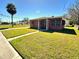 Charming home with a well-maintained lawn and mature trees at 318 Banana St, Tarpon Springs, FL 34689