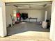 Empty garage interior with concrete floors and ample space for parking or projects at 318 Banana St, Tarpon Springs, FL 34689