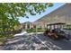 Charming exterior showcases a well-maintained home with a golf cart parked under the carport at 319 Kelsey Way, Sun City Center, FL 33573