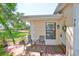 Cozy covered front porch with seating area, perfect for enjoying the outdoors in a quaint space at 319 Kelsey Way, Sun City Center, FL 33573