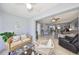 Inviting living space featuring a sunroom, tile floors, and an open floor plan at 319 Kelsey Way, Sun City Center, FL 33573