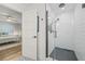 Chic bathroom with a modern glass shower and subway tile, open to a cozy bedroom for a seamless flow at 3215 W Fair Oaks Ave, Tampa, FL 33611