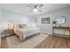 Light and airy bedroom with hardwood floors, a ceiling fan, and neutral tones creating a relaxing atmosphere at 3215 W Fair Oaks Ave, Tampa, FL 33611