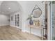 Bright foyer featuring hardwood floors, stylish decor, and a welcoming ambiance at 3215 W Fair Oaks Ave, Tampa, FL 33611