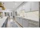 Modern kitchen with sleek countertops, a custom backsplash, and a functional layout for easy meal prep at 3215 W Fair Oaks Ave, Tampa, FL 33611