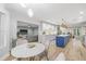 Open kitchen and living space featuring modern appliances, a kitchen island, and a comfortable living area at 3215 W Fair Oaks Ave, Tampa, FL 33611