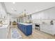 Gourmet kitchen with a large island, stainless steel appliances, and ample counter space for cooking at 3215 W Fair Oaks Ave, Tampa, FL 33611