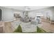 Open concept living room showcasing hardwood floors, calming colors, and seamless flow to other spaces at 3215 W Fair Oaks Ave, Tampa, FL 33611