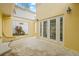 Enclosed patio featuring a garden window and double French doors at 3215 W Fair Oaks Ave, Tampa, FL 33611