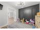 Well-lit playroom with decorative wall and stylish light fixture at 3215 W Fair Oaks Ave, Tampa, FL 33611