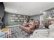 Fun recreation room featuring comfortable seating, a large TV, and football-themed decor at 3215 W Fair Oaks Ave, Tampa, FL 33611