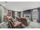 Cozy recreation room with comfortable seating, a large TV, and football-themed decor at 3215 W Fair Oaks Ave, Tampa, FL 33611