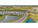 Picture of an attractive neighborhood featuring meticulously maintained lawns and serene water views at 3504 Golden Wheat Ln, Plant City, FL 33565