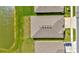 An aerial top-down view of a home with neighborhood surroundings, a serene pond, and a manicured lawn at 3504 Golden Wheat Ln, Plant City, FL 33565