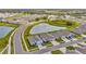 Beautiful aerial view of homes in a well-planned community with scenic pond and green spaces at 3504 Golden Wheat Ln, Plant City, FL 33565
