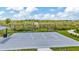 Community basketball court with a full court, hoop, and a shaded seating area at 3504 Golden Wheat Ln, Plant City, FL 33565