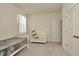 Bedroom featuring white walls, carpet flooring, and a crib with a view through the window at 3504 Golden Wheat Ln, Plant City, FL 33565