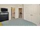 Bright bedroom showcasing closet and bathroom access, offering convenience and modern appeal at 3504 Golden Wheat Ln, Plant City, FL 33565