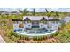 Attractive community entrance with elegant signage, beautiful landscaping, and a serene water feature at 3504 Golden Wheat Ln, Plant City, FL 33565