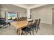 Open dining room with modern table/chairs, leading into living room with water views at 3504 Golden Wheat Ln, Plant City, FL 33565
