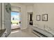 Welcoming entryway with tiled floor, decorative bench, and view into a bedroom at 3504 Golden Wheat Ln, Plant City, FL 33565