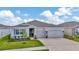 Charming single-story home with a three-car garage and well-maintained landscaping at 3504 Golden Wheat Ln, Plant City, FL 33565