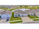 Inviting single-Gathering home with lush landscaping, a pond view and a three-car garage at 3504 Golden Wheat Ln, Plant City, FL 33565