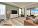 Bright living room with tray ceiling, modern furnishings, and expansive water views at 3504 Golden Wheat Ln, Plant City, FL 33565