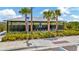 Community mailboxes surrounded by landscaping and palm trees at 3504 Golden Wheat Ln, Plant City, FL 33565