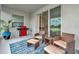 Covered patio with wicker furniture, BBQ grill, and expansive water view at 3504 Golden Wheat Ln, Plant City, FL 33565