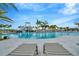Relaxing lounge chairs next to a lovely community pool and fun water slide at 3504 Golden Wheat Ln, Plant City, FL 33565