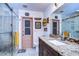 Bathroom features a walk-in shower, tile flooring, granite counters, and custom fixtures at 4215 Water Oaks Ln, Tampa, FL 33618