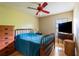 Bedroom with a traditional wooden bed frame and ceiling fan at 4215 Water Oaks Ln, Tampa, FL 33618