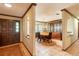 Inviting dining room featuring a wood table, china cabinet, and tile flooring with an archway into the entry at 4215 Water Oaks Ln, Tampa, FL 33618